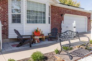 View of patio featuring a garage