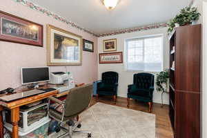 Home office featuring light hardwood / wood-style flooring