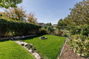 View of yard with a fire pit