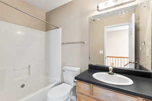 Full bathroom with  shower combination, vanity, and toilet