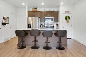 Kitchen with Quartz Countertops and Stainless Steel Appliances