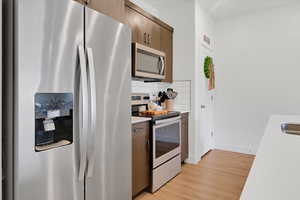 Kitchen with Quartz Countertops and Stainless Steel Appliances