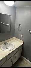 Bathroom featuring tile patterned flooring and vanity