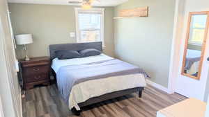 Bedroom with hardwood / wood-style flooring and ceiling fan