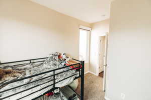 View of carpeted bedroom