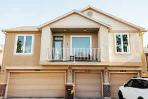 Multi unit property with a balcony and a garage