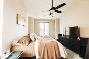 Carpeted bedroom with ceiling fan