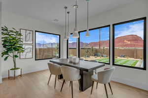 Dining area featuring a mountain view and light hardwood / wood-style floors