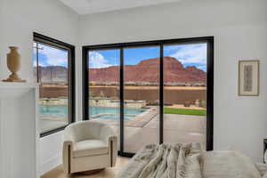 Bedroom featuring a water and mountain view and access to exterior