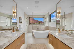 Bathroom with vanity and plus walk in shower