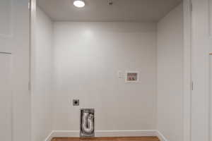 Laundry area featuring washer hookup, hardwood / wood-style flooring, and electric dryer hookup