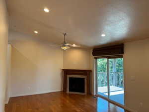 Family Room with ceiling fan and hardwood floors and sliding doors to covered deck