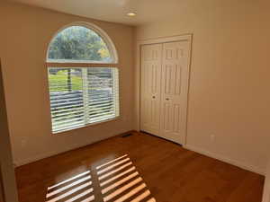 Main floor Den or Bedroom with hardwood floors and mountain views