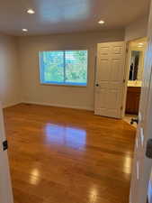 Master Bedroom with hardwood floors, walk in closet, views of the valley, and ensuite.