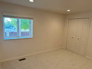 Large Bedroom with two closets, window and brand new carpet and pad