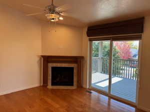 Family Room with ceiling fan and hardwood floors and sliding doors to covered deck