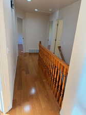 Hallway featuring hardwood flooring