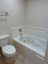 Master Bathroom with private jetted tub and separate shower.