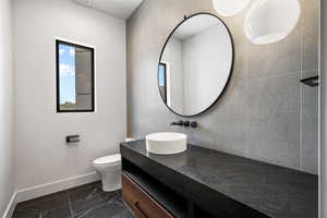 Bathroom featuring vanity and toilet