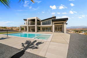 View of pool featuring an in ground hot tub, a mountain view, and a patio area. Old photo. House now has a waterslide.