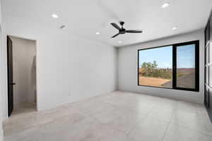 Empty room featuring ceiling fan