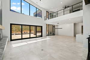 living room featuring  high-ceiling