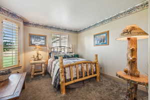 Bedroom with carpet and baseboards
