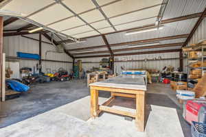 Garage with a garage door opener and metal wall