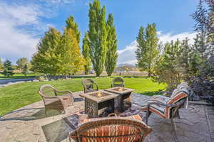 View of patio / terrace featuring an outdoor fire pit