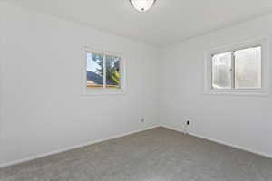 View of carpeted spare room