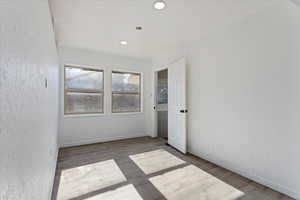 Empty room featuring hardwood / wood-style flooring