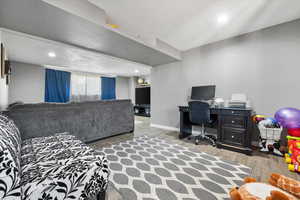 Living room with hardwood / wood-style flooring