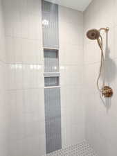 Bathroom with tiled shower