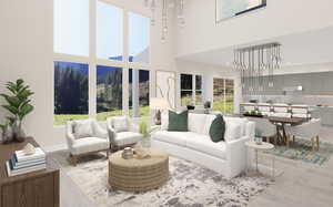 Living room featuring a high ceiling and light hardwood / wood-style floors