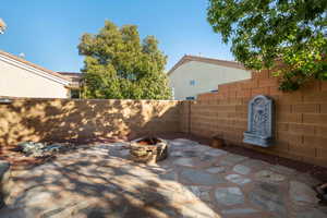 View of patio / terrace featuring an outdoor fire pit