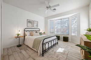 Bedroom featuring light hardwood / wood-style floors and ceiling fan