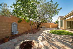 View of patio featuring a fire pit