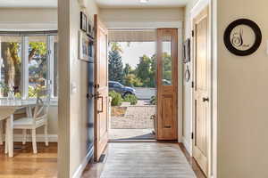 Entryway featuring light wood-type flooring and a wealth of natural light