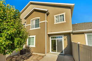 Back of house featuring a patio and central AC unit