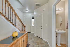 Foyer entrance and guest bath