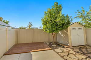 View of patio / terrace featuring a shed