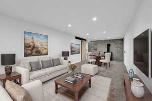 Living room featuring a barn door and a wood stove