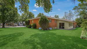 Back of property with brick siding
