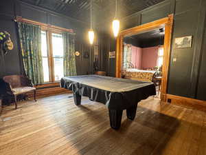 Game room featuring hardwood / wood-style flooring and billiards