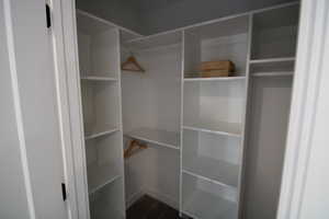 Primary bedroom closet with custom shelving