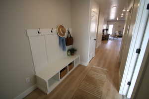 Mudroom featuring light wood-type flooring