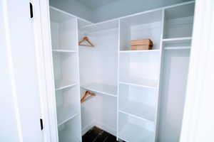 Primary bedroom closet with custom shelving
