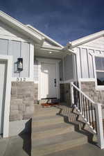 View of exterior entry featuring a garage