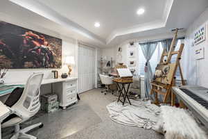 Office area featuring crown molding, recessed lighting, and a raised ceiling