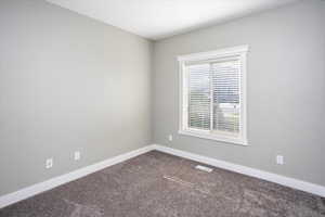 Bedroom 2 featuring carpet flooring